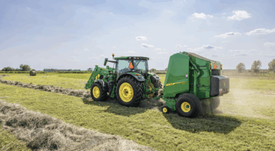 John Deere baler in a field